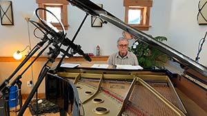 Don Grusin is seen in his Moose Sound studio at his Yamaha C7FII grand piano. Photo by Rob Friedrich.